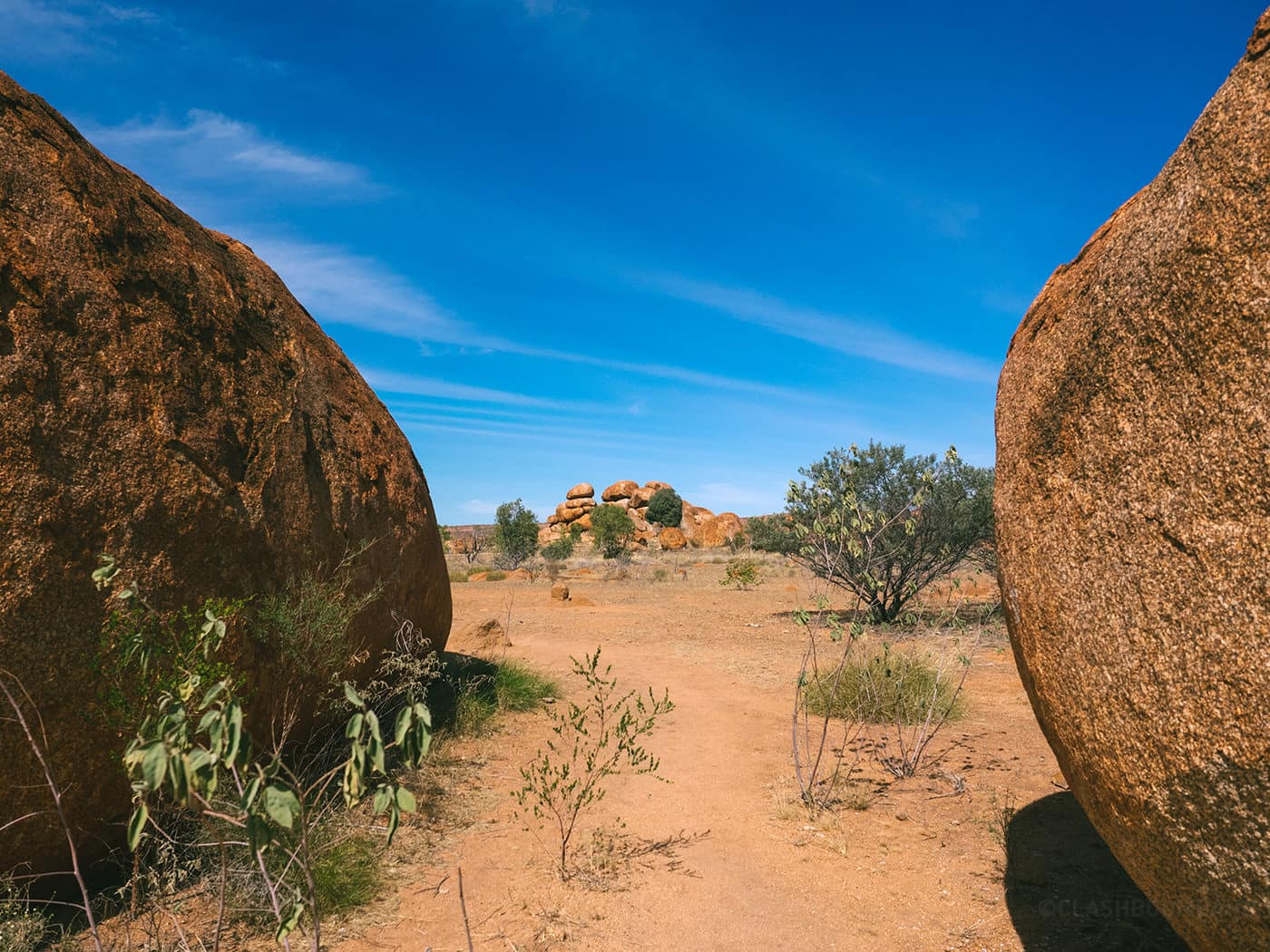NT Australia - Karlu Karlu - Stack of boulders peeping through 2 huge boulders